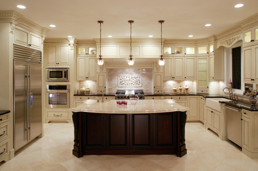 Inspiration for a mid-sized timeless u-shaped marble floor and beige floor enclosed kitchen remodel in DC Metro with a farmhouse sink, raised-panel cabinets, light wood cabinets, quartz countertops, brown backsplash, subway tile backsplash, stainless steel appliances and an island