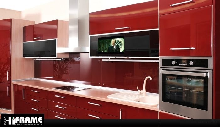 Imagen de cocina lineal minimalista de tamaño medio cerrada con fregadero encastrado, armarios con paneles lisos, puertas de armario rojas, encimera de acero inoxidable, salpicadero rojo, electrodomésticos de acero inoxidable y una isla