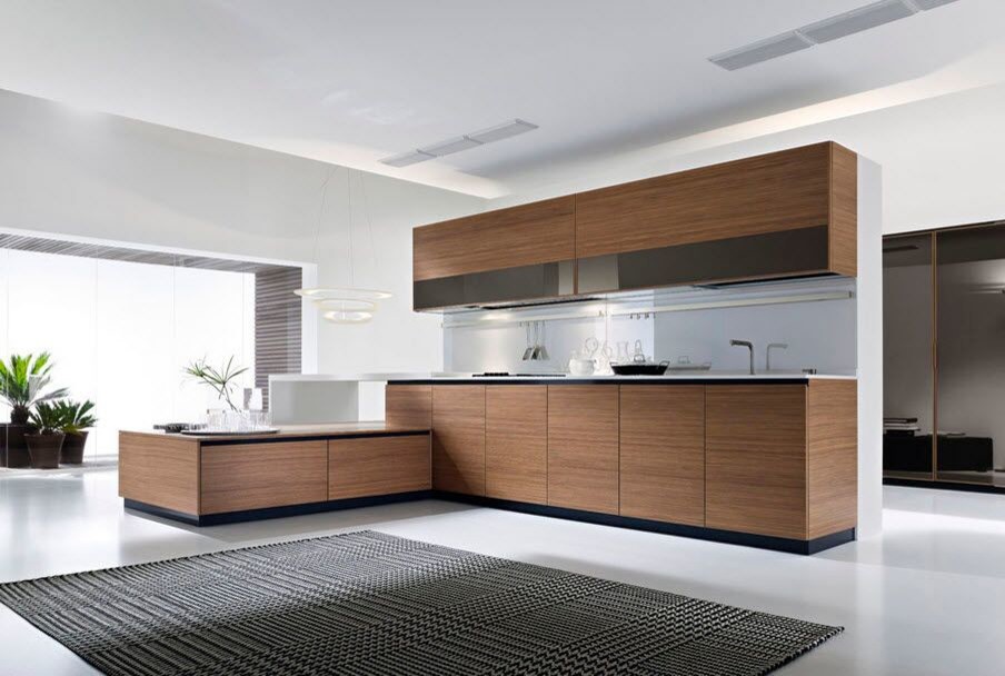 This is an example of a small midcentury l-shaped open plan kitchen in Toronto with a submerged sink, flat-panel cabinets, medium wood cabinets, wood worktops, white splashback, glass sheet splashback, stainless steel appliances, white floors and brown worktops.