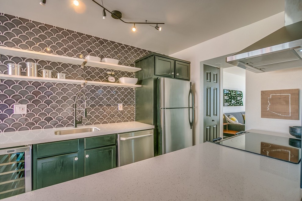 Inspiration for a mid-sized 1960s kitchen remodel in Phoenix with an undermount sink, shaker cabinets, green cabinets, terrazzo countertops, gray backsplash, porcelain backsplash, stainless steel appliances and an island