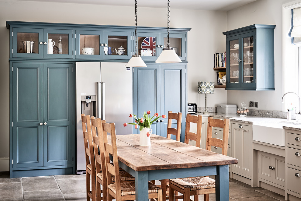 Large elegant ceramic tile and brown floor eat-in kitchen photo in Other with a farmhouse sink, beaded inset cabinets, gray cabinets, granite countertops, blue backsplash, mosaic tile backsplash, colored appliances, no island and gray countertops