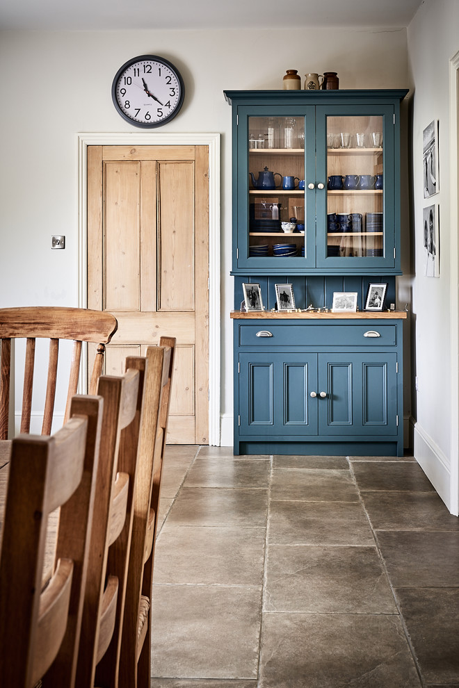 Inspiration for a large timeless ceramic tile and brown floor eat-in kitchen remodel in Other with a farmhouse sink, beaded inset cabinets, gray cabinets, granite countertops, blue backsplash, mosaic tile backsplash, colored appliances, no island and gray countertops