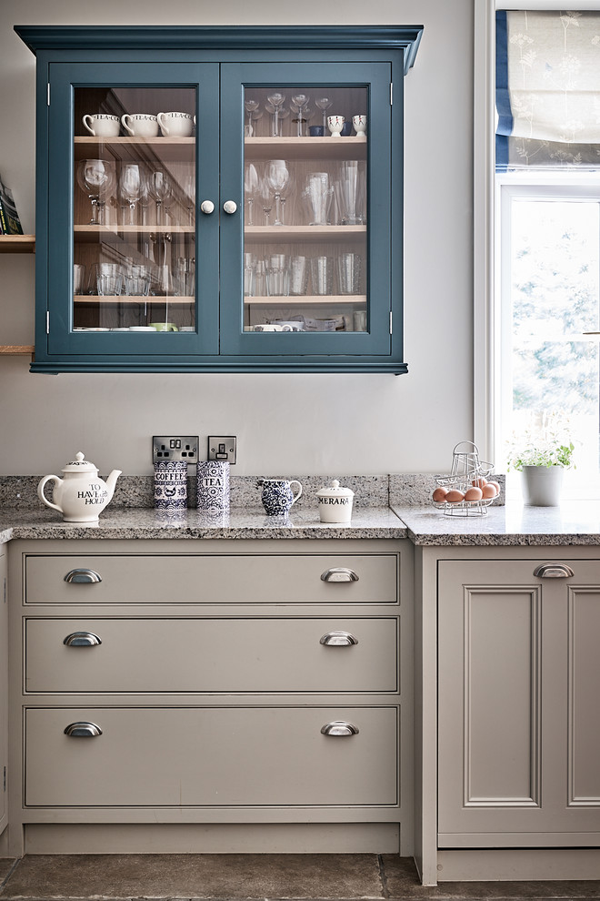 Large elegant ceramic tile and brown floor eat-in kitchen photo in Other with a farmhouse sink, beaded inset cabinets, gray cabinets, granite countertops, blue backsplash, mosaic tile backsplash, colored appliances, no island and gray countertops