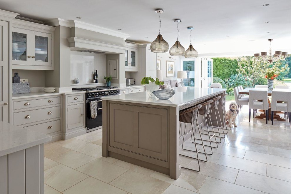Photo of an expansive modern u-shaped kitchen pantry in Toronto with grey cabinets, limestone worktops, grey splashback, slate flooring, beige floors and beige worktops.