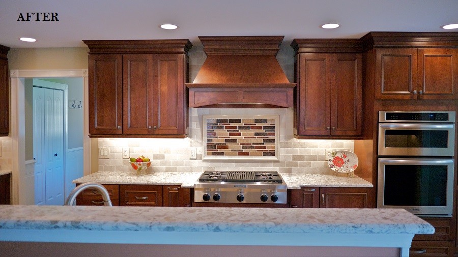 Mid-sized tuscan galley limestone floor eat-in kitchen photo in Philadelphia with an undermount sink, raised-panel cabinets, subway tile backsplash, stainless steel appliances, no island, brown cabinets, granite countertops and beige backsplash