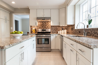 Gorgeous two story kitchen, granite countertops, pendant lighting, blue  mosaic backsplash tile, g…