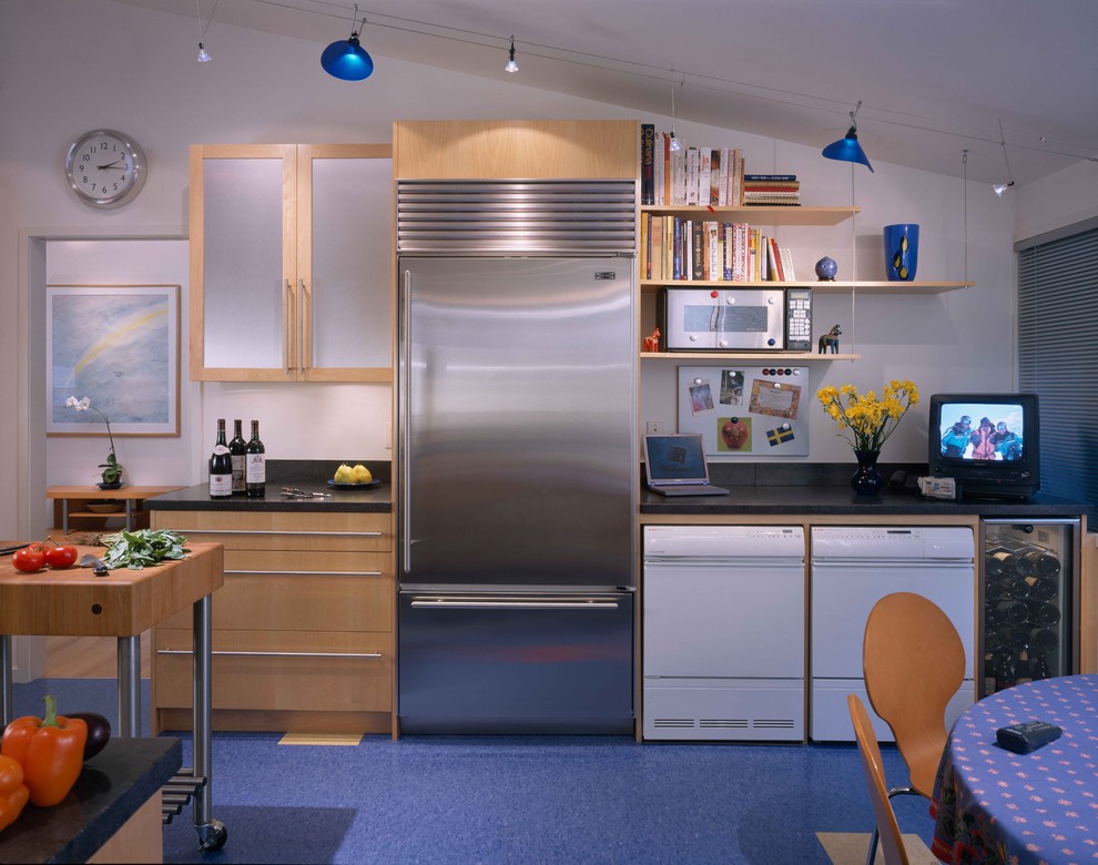 Trendy eat-in kitchen photo in DC Metro with glass-front cabinets, light wood cabinets and stainless steel appliances