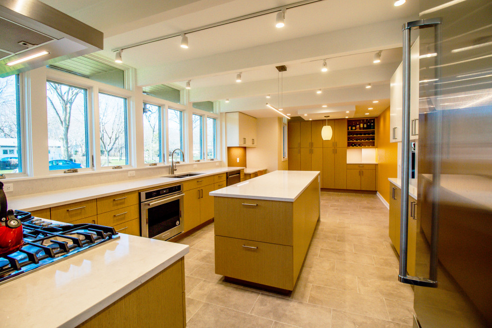Photo of a large contemporary galley enclosed kitchen in Chicago with a submerged sink, flat-panel cabinets, medium wood cabinets, quartz worktops, stainless steel appliances, ceramic flooring, an island, grey floors, white worktops and exposed beams.