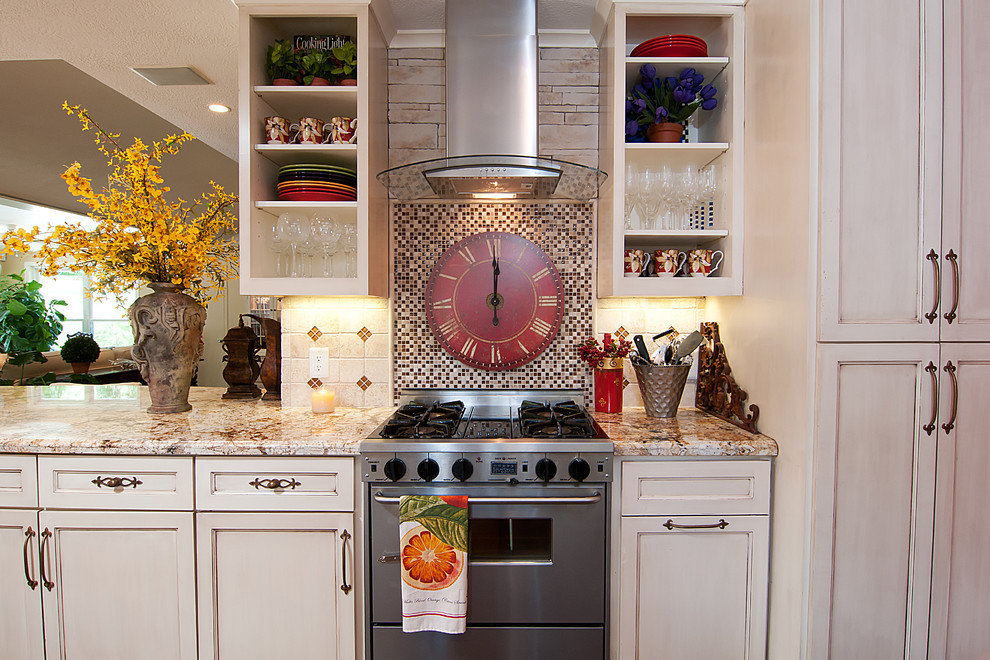 Example of an island style kitchen design in Houston with mosaic tile backsplash, stainless steel appliances, open cabinets, white cabinets and multicolored backsplash