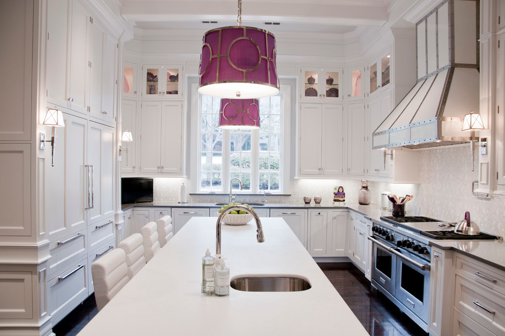 Large elegant u-shaped dark wood floor kitchen photo in Dallas with an undermount sink, recessed-panel cabinets, white cabinets, white backsplash, stainless steel appliances and an island