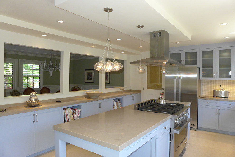 Inspiration for a large traditional l-shaped enclosed kitchen in San Francisco with a single-bowl sink, recessed-panel cabinets, grey cabinets, limestone worktops, beige splashback, stainless steel appliances, limestone flooring and an island.