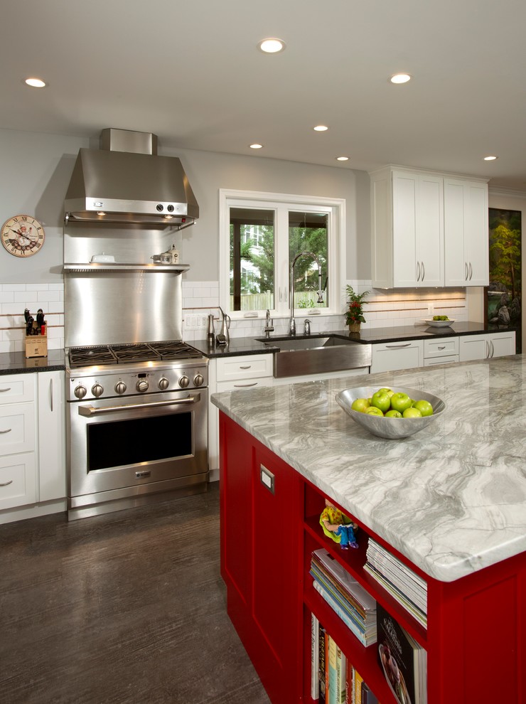 Example of a trendy kitchen design in DC Metro with an island