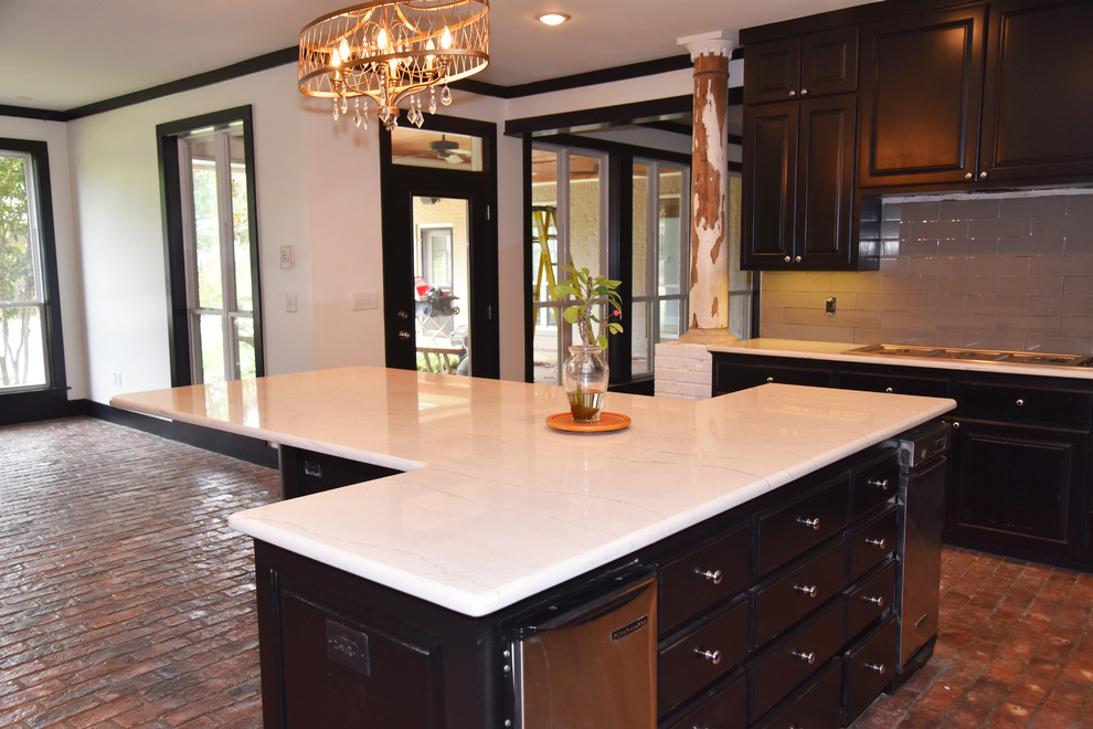 Example of a mid-sized transitional l-shaped brick floor and red floor enclosed kitchen design in Dallas with an undermount sink, beaded inset cabinets, gray cabinets, marble countertops, white backsplash, ceramic backsplash, stainless steel appliances and an island