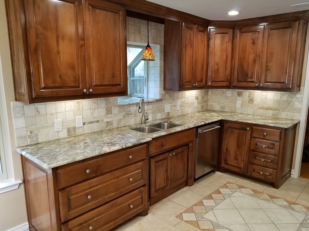 Photo of a medium sized classic galley kitchen/diner in Dallas with a submerged sink, raised-panel cabinets, medium wood cabinets, granite worktops, beige splashback, stone tiled splashback, stainless steel appliances, ceramic flooring, no island and beige floors.
