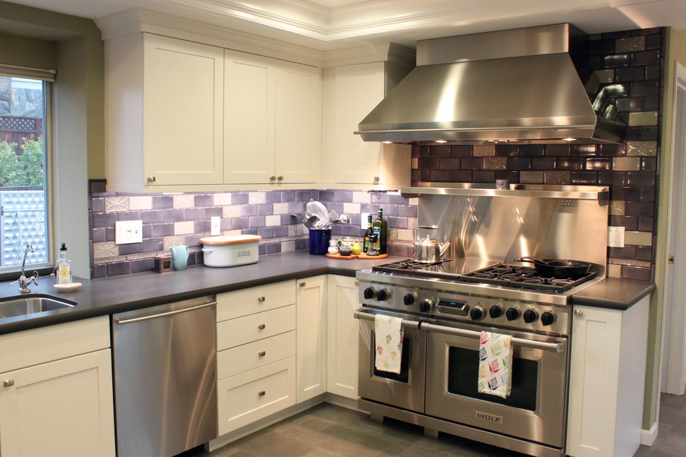 This is an example of a bohemian grey and purple kitchen in San Francisco with stainless steel appliances, a submerged sink, shaker cabinets, white cabinets, multi-coloured splashback and metro tiled splashback.