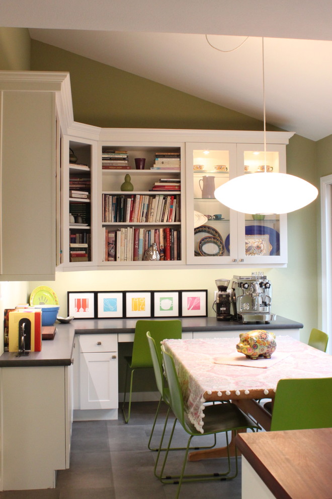 Eclectic eat-in kitchen photo in San Francisco with glass-front cabinets and white cabinets