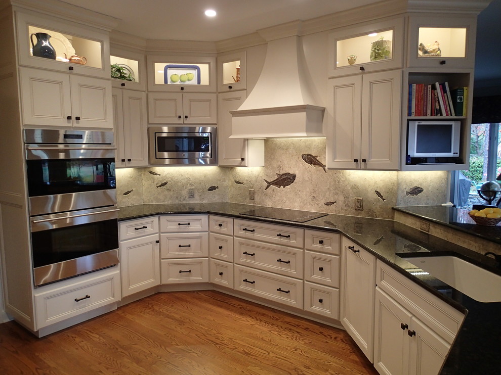 Inspiration for a transitional kitchen remodel in Raleigh with recessed-panel cabinets, white cabinets and granite countertops