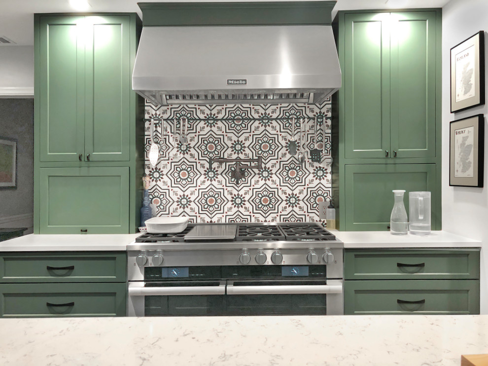 Inspiration for a large contemporary galley ceramic tile and brown floor eat-in kitchen remodel in DC Metro with a farmhouse sink, recessed-panel cabinets, green cabinets, quartz countertops, multicolored backsplash, ceramic backsplash, stainless steel appliances, an island and white countertops