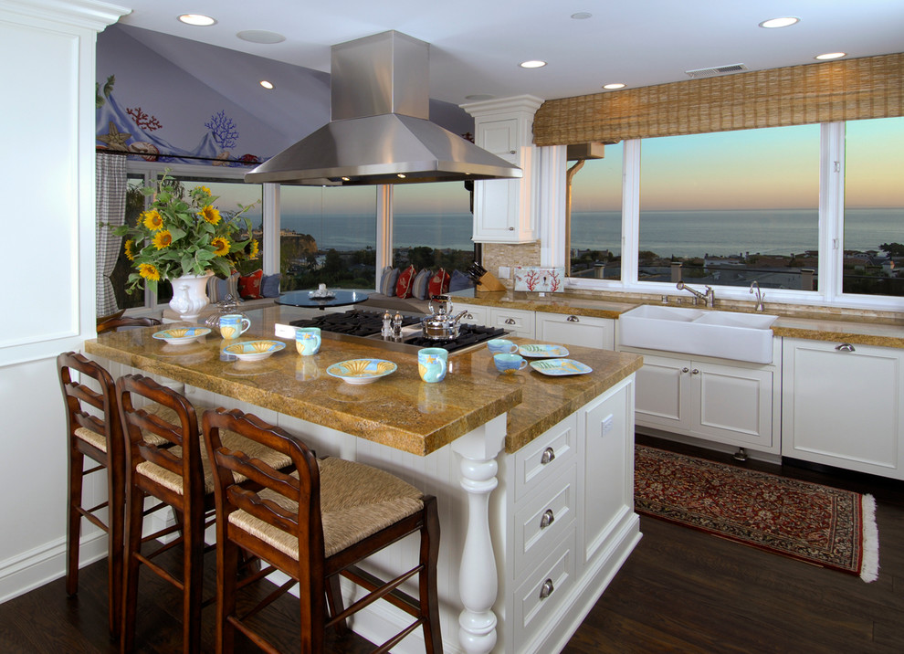 Inspiration for a coastal kitchen remodel in Orange County with white cabinets