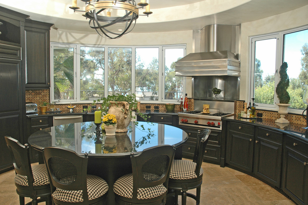 Open concept kitchen - mid-sized transitional u-shaped ceramic tile and beige floor open concept kitchen idea in San Diego with raised-panel cabinets, black cabinets, quartz countertops, beige backsplash, ceramic backsplash, stainless steel appliances, an island and black countertops
