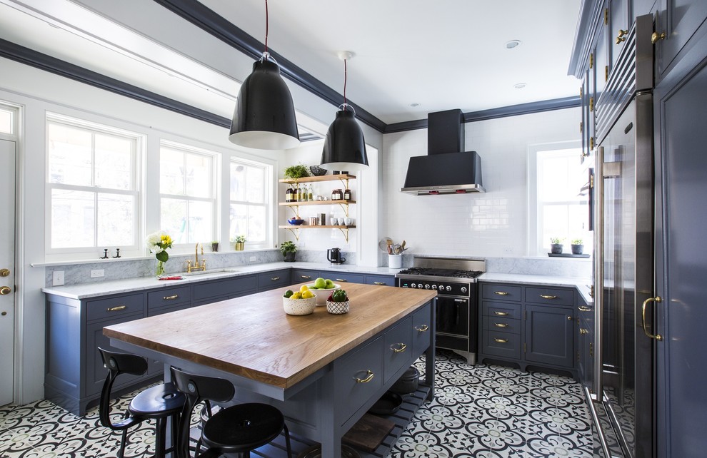 Inspiration for a large timeless u-shaped cement tile floor and multicolored floor eat-in kitchen remodel in Other with an undermount sink, shaker cabinets, blue cabinets, white backsplash, subway tile backsplash, an island, marble countertops and stainless steel appliances