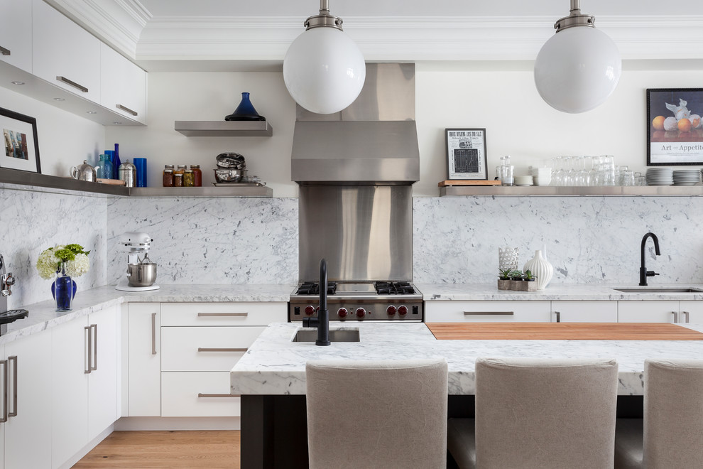 Inspiration for a contemporary l-shaped kitchen remodel in Toronto with white backsplash, an island and marble backsplash