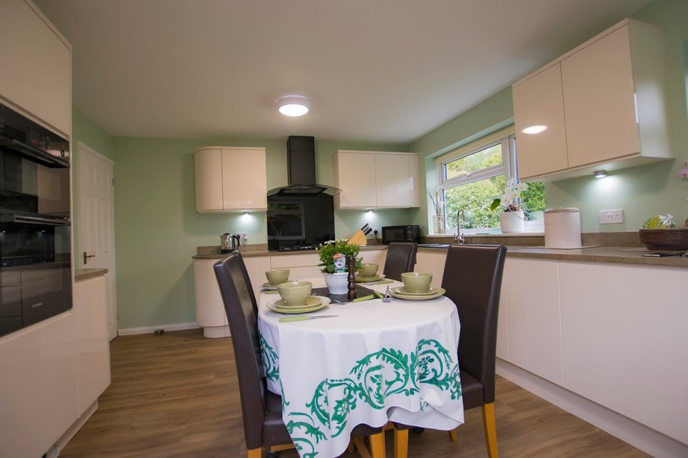 This is an example of a large modern kitchen in Essex.