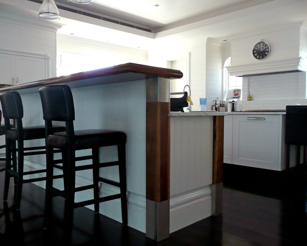 Example of a transitional kitchen design in Brisbane