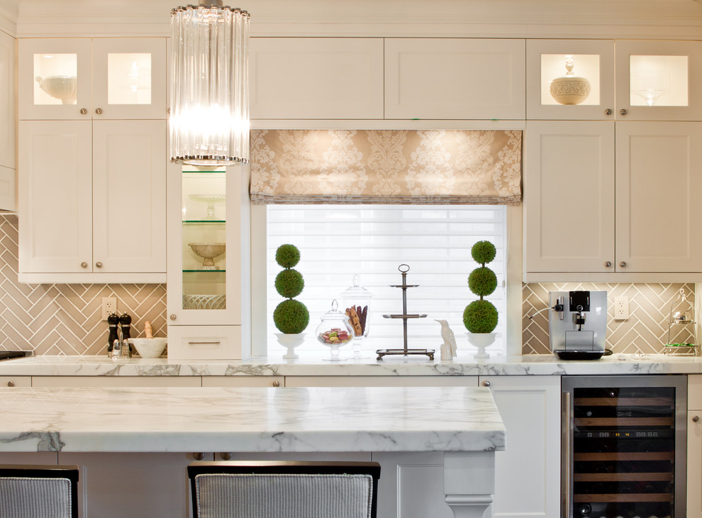 Ornate kitchen photo in Toronto with recessed-panel cabinets, white cabinets, marble countertops, brown backsplash, stainless steel appliances and ceramic backsplash