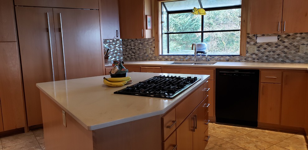 Medium sized traditional u-shaped kitchen/diner in Portland with a double-bowl sink, flat-panel cabinets, light wood cabinets, quartz worktops, multi-coloured splashback, glass tiled splashback, integrated appliances, laminate floors, an island, beige worktops and beige floors.