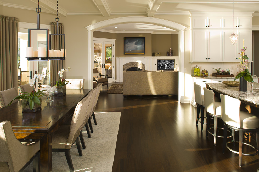 Elegant eat-in kitchen photo in Minneapolis with white cabinets