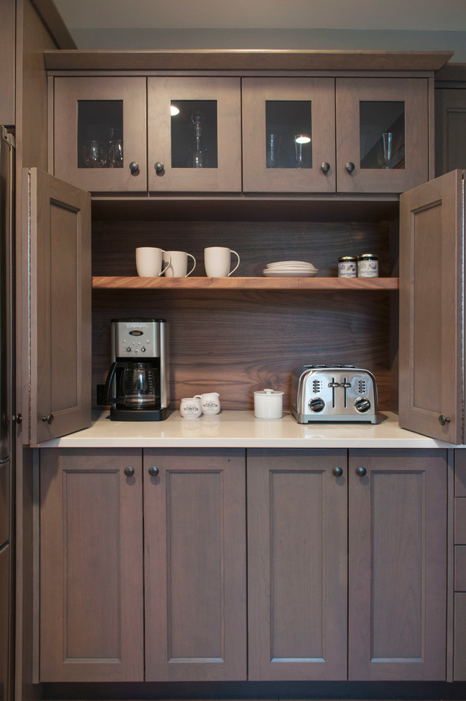 Medium sized traditional kitchen pantry in Burlington with shaker cabinets, grey cabinets, engineered stone countertops, brown splashback and stainless steel appliances.