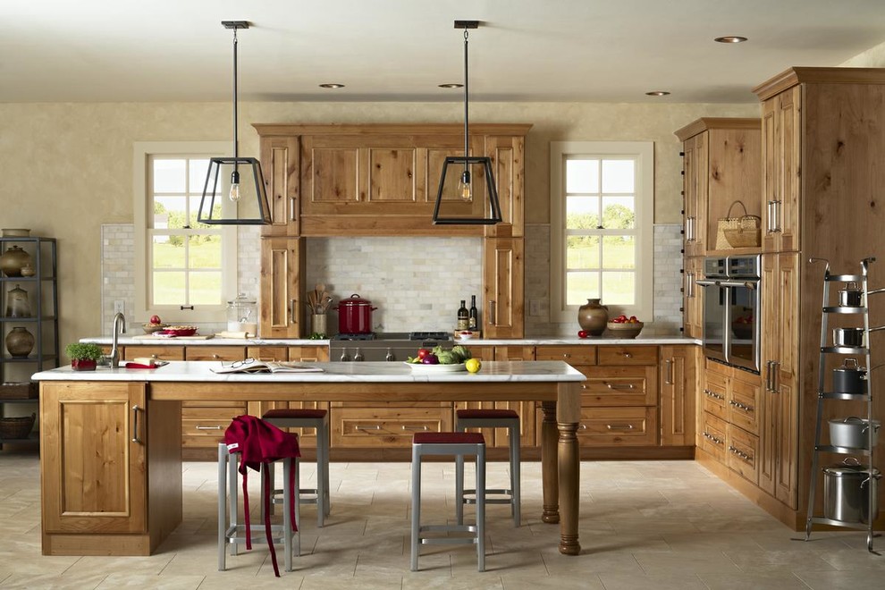 Design ideas for a medium sized rustic l-shaped kitchen/diner in Orange County with recessed-panel cabinets, medium wood cabinets, marble worktops, grey splashback, marble splashback, stainless steel appliances, ceramic flooring, an island and beige floors.