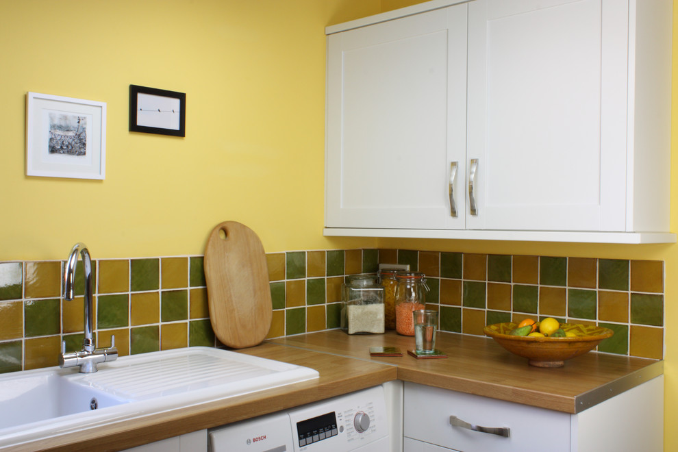 Example of a cottage kitchen design in Other with ceramic backsplash