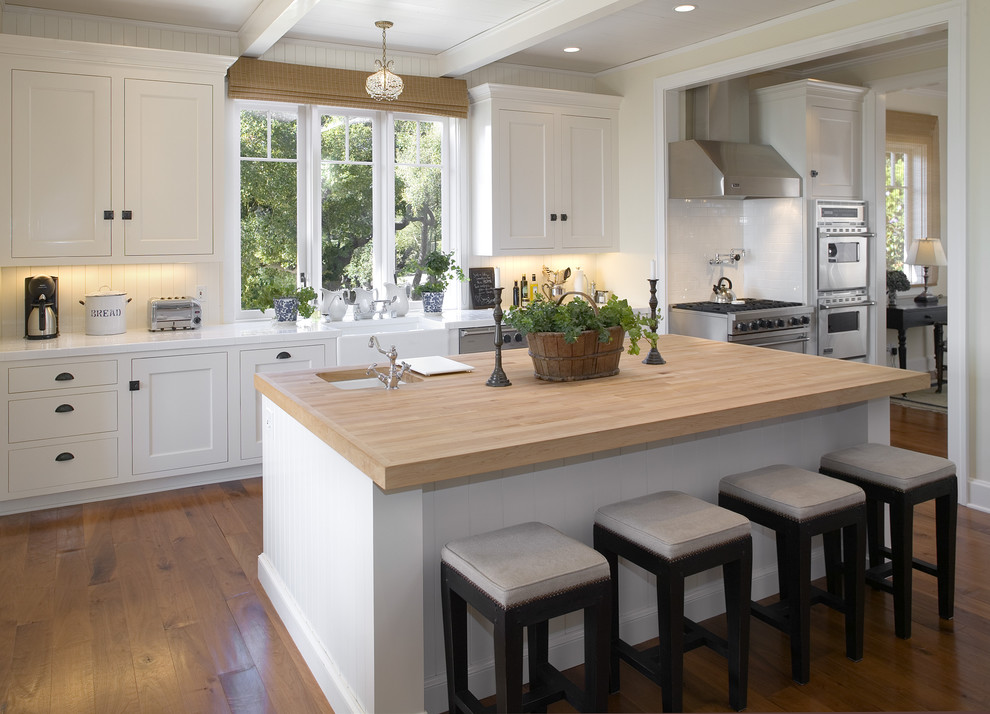 Inspiration for a modern kitchen in Santa Barbara with stainless steel appliances and wood worktops.