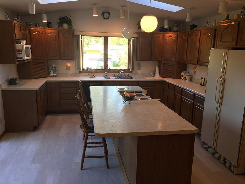 Kitchen Transformation Done with New Laminate Countertop and Flooring
