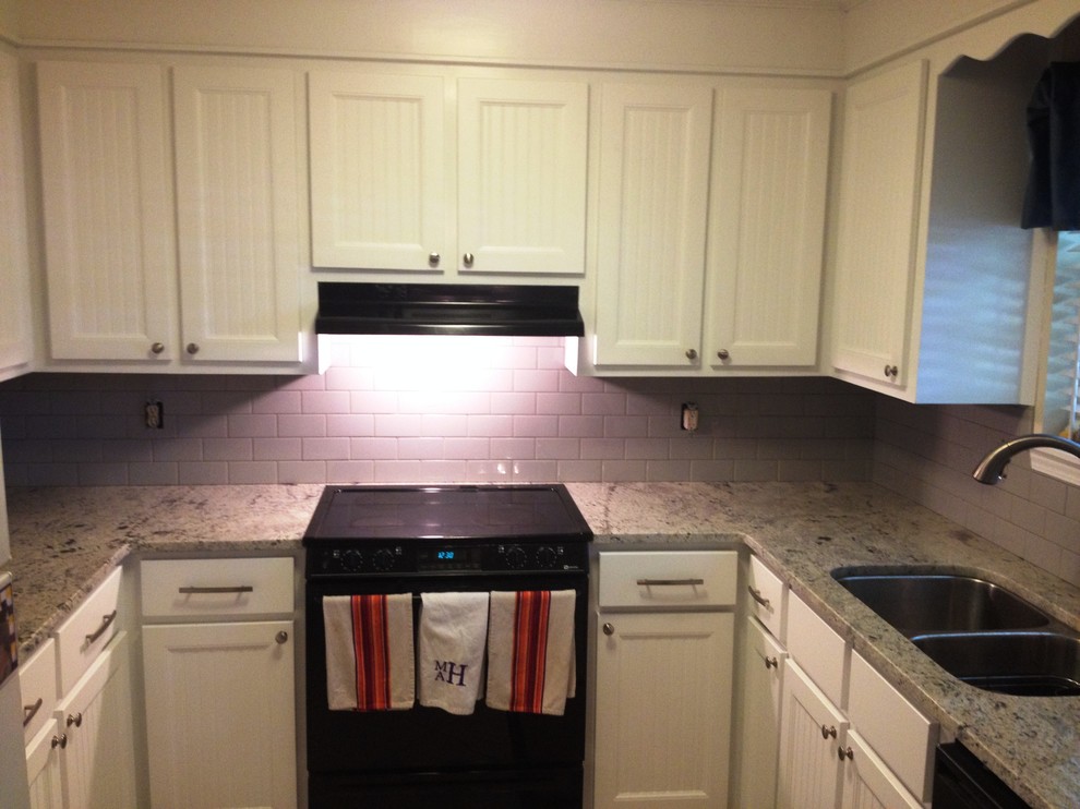 Photo of a small classic u-shaped kitchen/diner in Charleston with a submerged sink, white cabinets, granite worktops and ceramic splashback.