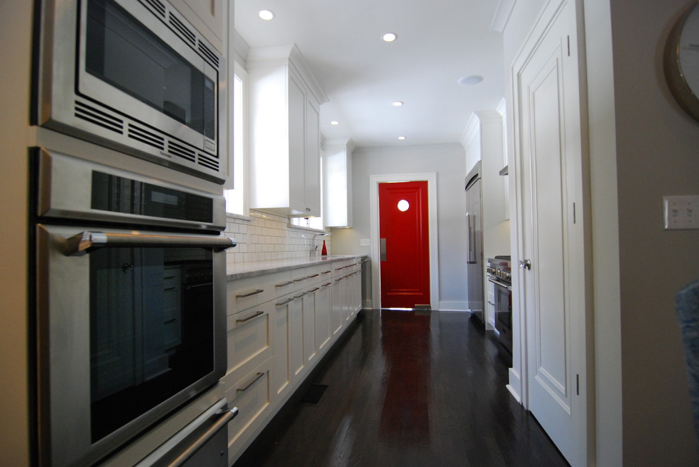 Trendy galley enclosed kitchen photo in Jacksonville with stainless steel appliances