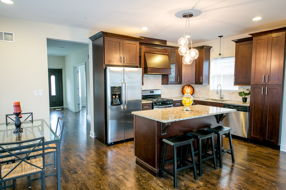 Mid-sized transitional l-shaped dark wood floor and brown floor eat-in kitchen photo in Phoenix with an undermount sink, shaker cabinets, dark wood cabinets, granite countertops, beige backsplash, mosaic tile backsplash, stainless steel appliances and an island