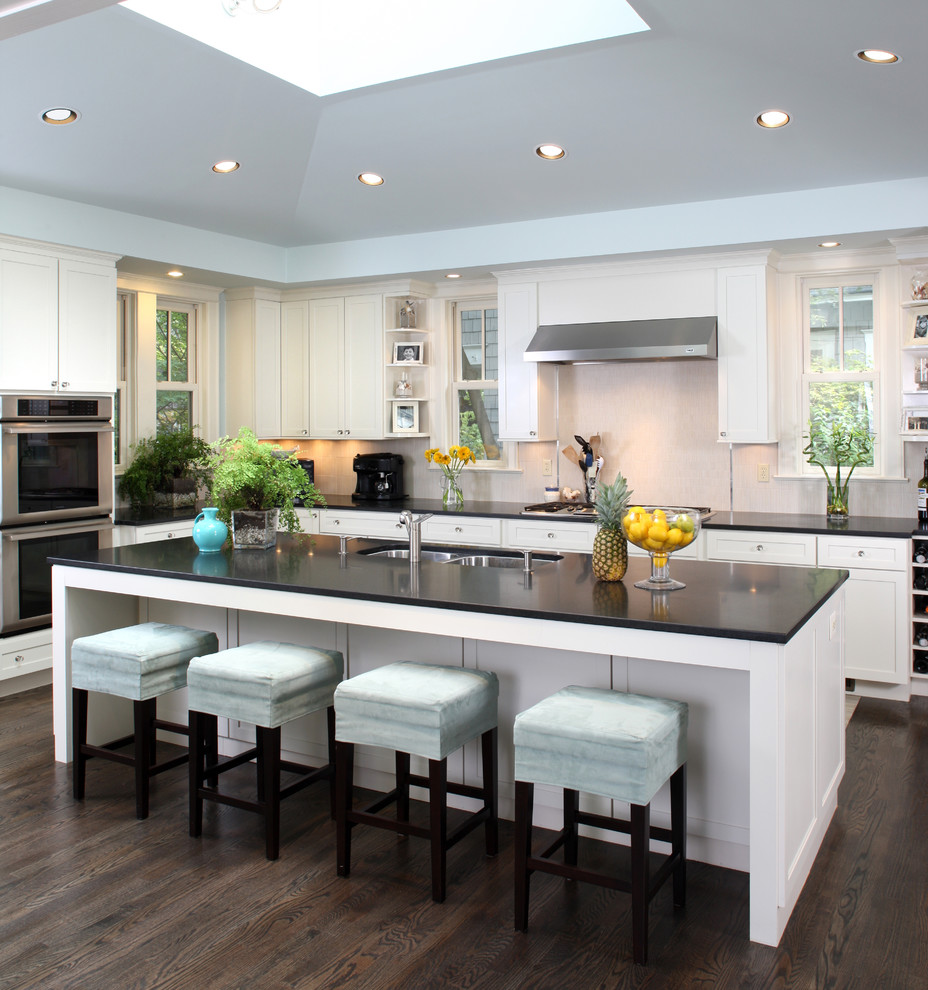 Transitional kitchen photo in DC Metro with stainless steel appliances, a double-bowl sink and white cabinets