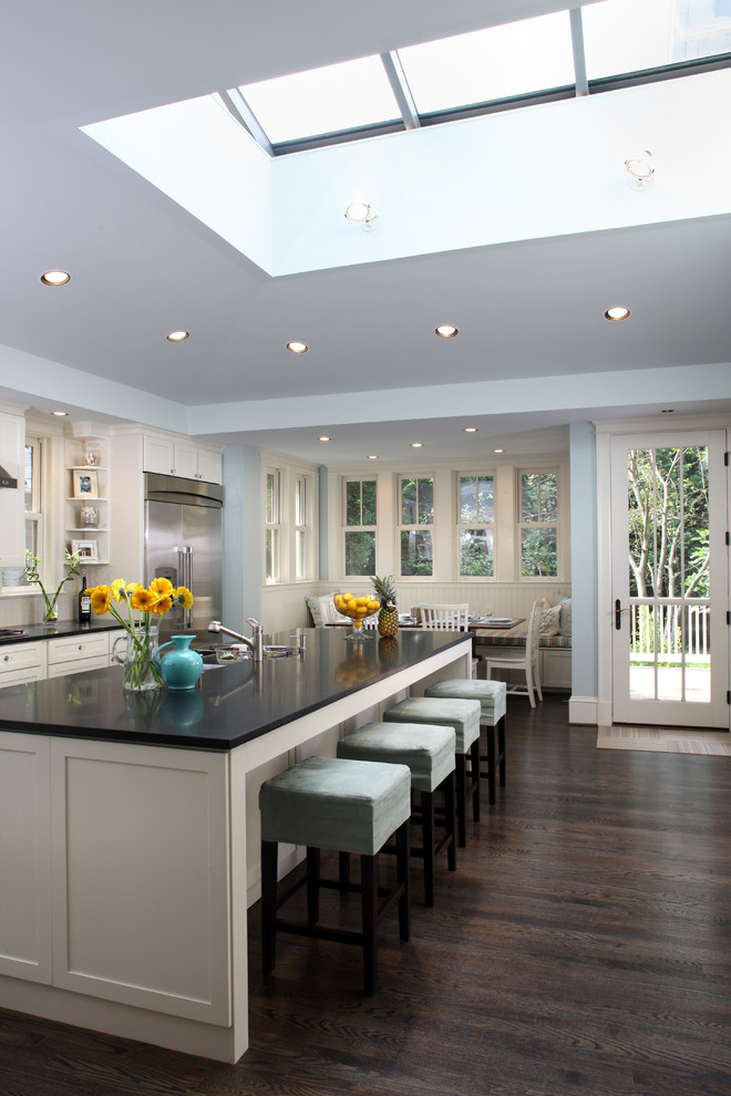 Classic kitchen/diner in DC Metro with black worktops.