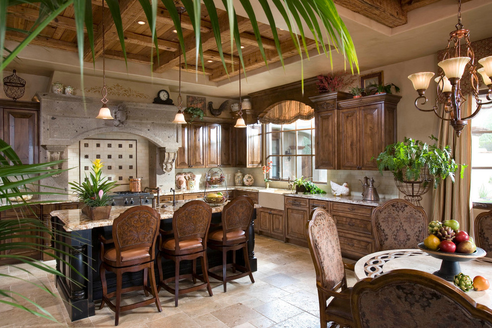 Example of a tuscan l-shaped eat-in kitchen design in Phoenix with a farmhouse sink, raised-panel cabinets, medium tone wood cabinets, granite countertops, beige backsplash, subway tile backsplash and paneled appliances