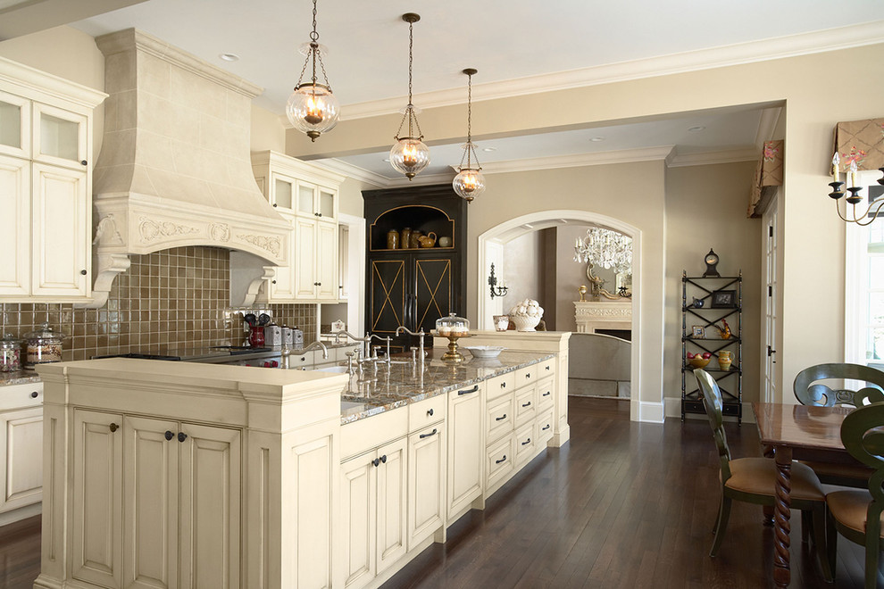 Eat-in kitchen - mid-sized traditional single-wall dark wood floor and brown floor eat-in kitchen idea in Minneapolis with raised-panel cabinets, white cabinets, brown backsplash, granite countertops, porcelain backsplash, an island and multicolored countertops