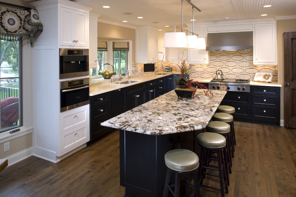 Design ideas for a contemporary kitchen in Minneapolis with shaker cabinets, black cabinets, beige splashback, stainless steel appliances, medium hardwood flooring, an island and a submerged sink.