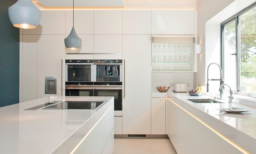 Example of a minimalist kitchen design in Sussex