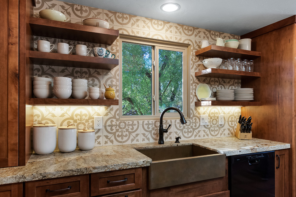 Mid-sized transitional galley terra-cotta tile and red floor eat-in kitchen photo in Phoenix with a farmhouse sink, flat-panel cabinets, brown cabinets, granite countertops, beige backsplash, cement tile backsplash, black appliances, an island and beige countertops