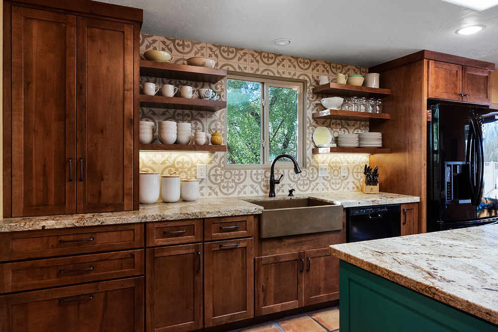 Example of a mid-sized transitional galley terra-cotta tile and red floor eat-in kitchen design in Other with flat-panel cabinets, brown cabinets, granite countertops, beige backsplash, black appliances, an island, beige countertops, a farmhouse sink and cement tile backsplash