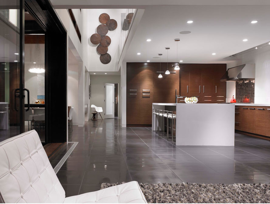 Example of a large minimalist l-shaped open concept kitchen design in Vancouver with quartz countertops, multicolored backsplash, metal backsplash, paneled appliances, an integrated sink, flat-panel cabinets and medium tone wood cabinets