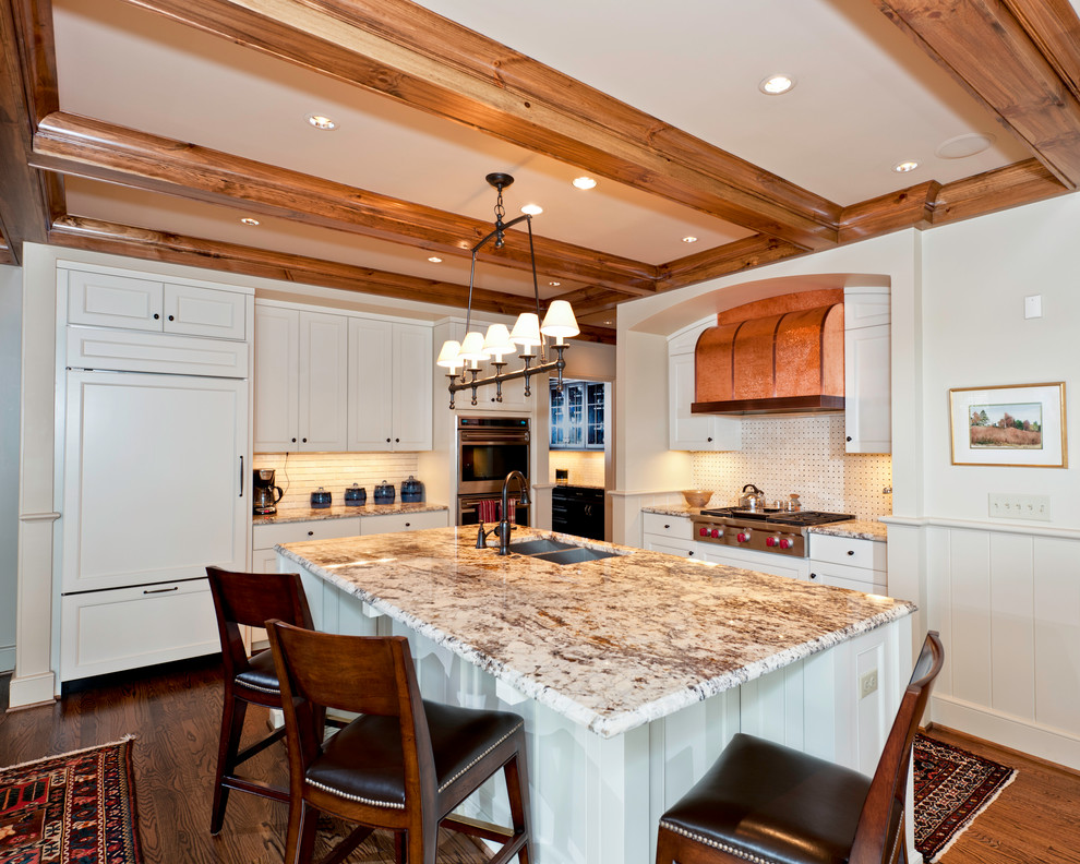 Kitchen - traditional l-shaped kitchen idea in Charlotte with a double-bowl sink, recessed-panel cabinets, white cabinets, multicolored backsplash and paneled appliances