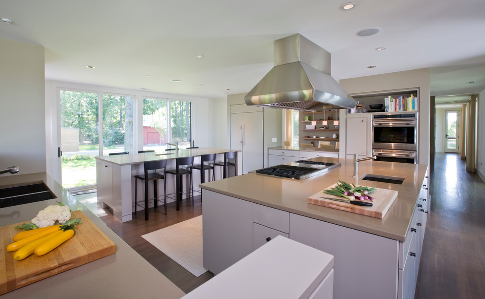 Trendy eat-in kitchen photo in Baltimore with an undermount sink, flat-panel cabinets, beige cabinets, quartz countertops and paneled appliances